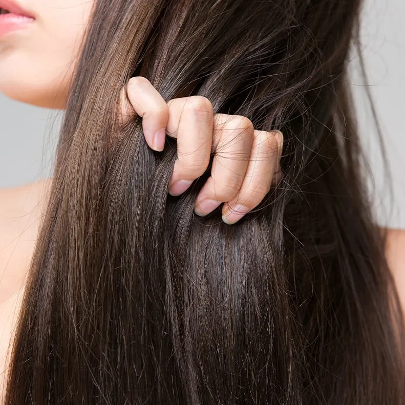 Person running fingers through wet hair